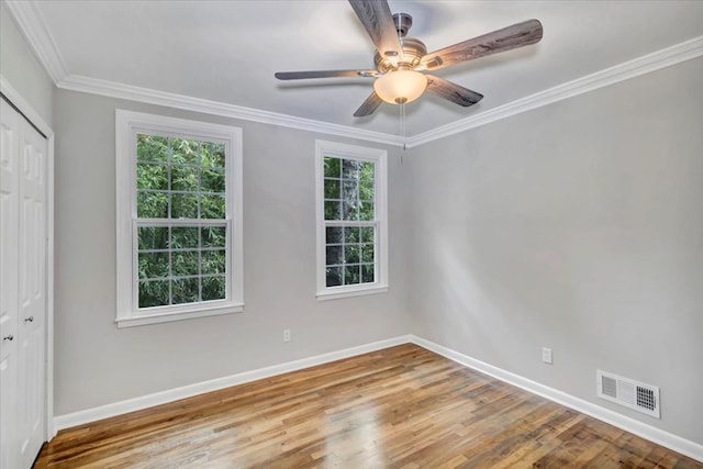 unfurnished room with ceiling fan, ornamental molding, and light wood-type flooring