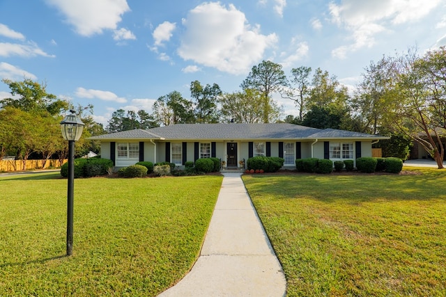 ranch-style home with a front yard