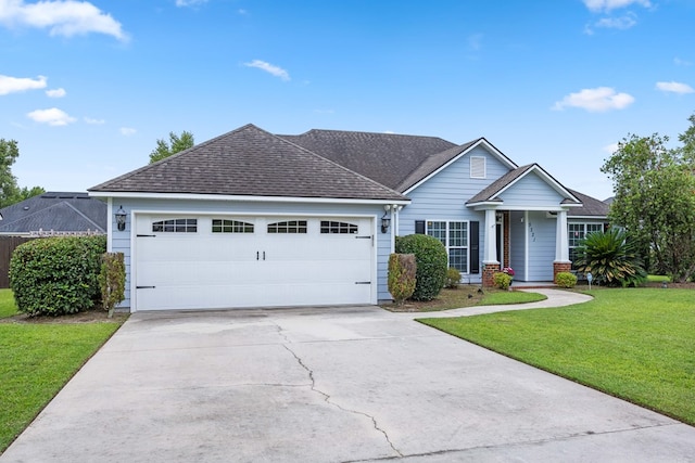 5221 Carys Brook Dr, Hahira, GA 31632 - view of front of home with an attached garage, a front yard, concrete driveway, and a shingled roof