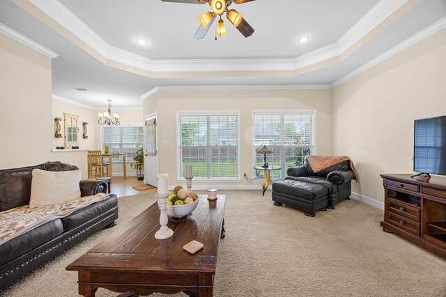 5221 Carys Brook Dr, Hahira, GA 31632 - living area with a raised ceiling, crown molding, a chandelier, carpet, and ceiling fan