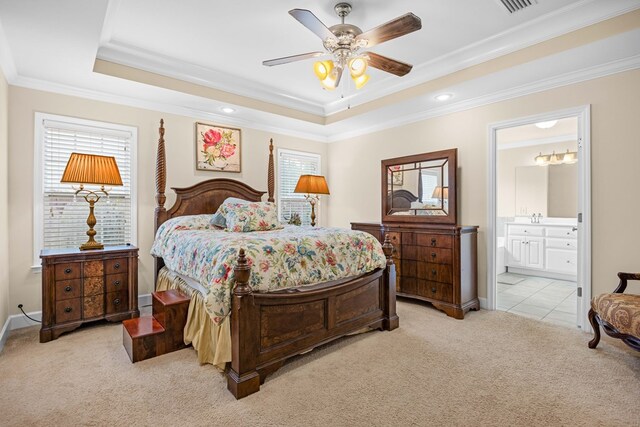 5221 Carys Brook Dr, Hahira, GA 31632 - bedroom featuring light carpet, a tray ceiling, ornamental molding, ensuite bathroom, and ceiling fan