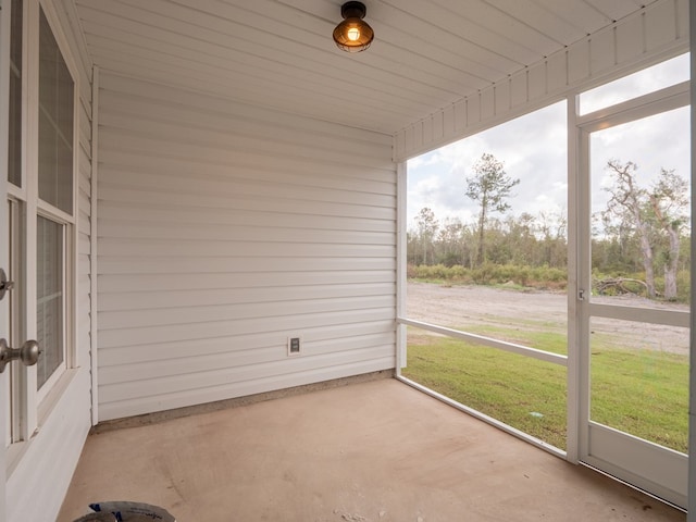 unfurnished sunroom with plenty of natural light