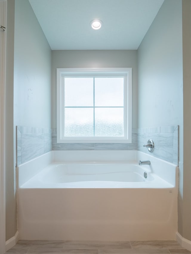 bathroom featuring a tub