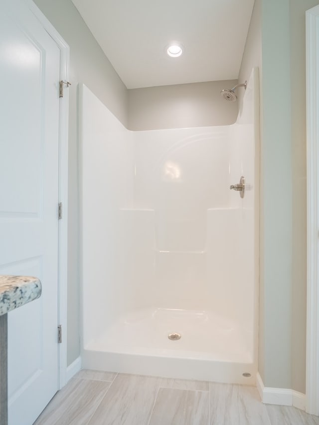 bathroom featuring walk in shower