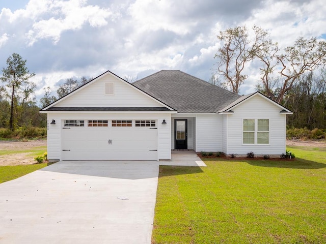 single story home with a garage and a front yard