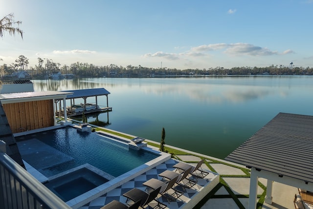 view of dock with an in ground hot tub and a water view