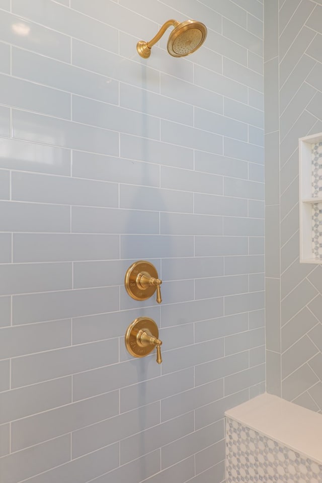 bathroom with tiled shower