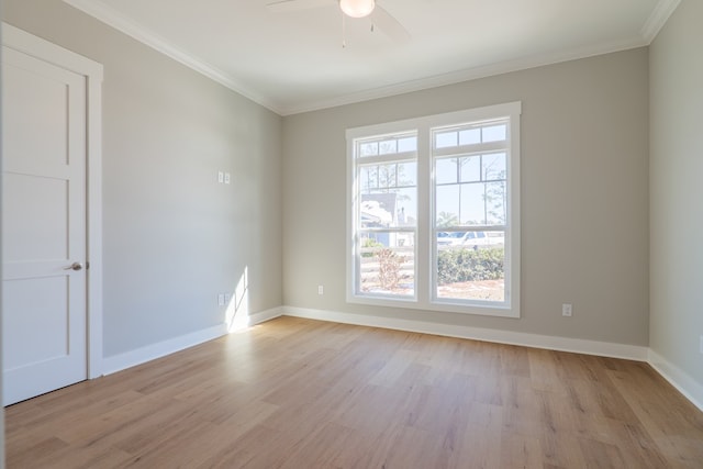 spare room featuring crown molding, ceiling fan, and light hardwood / wood-style floors