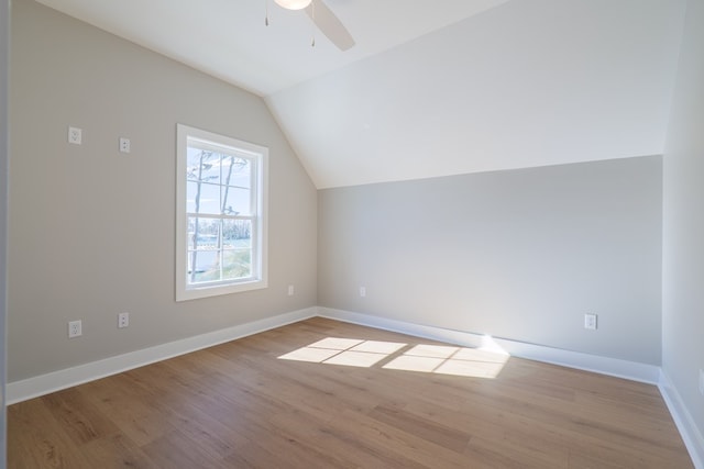 bonus room featuring ceiling fan, light hardwood / wood-style floors, and vaulted ceiling