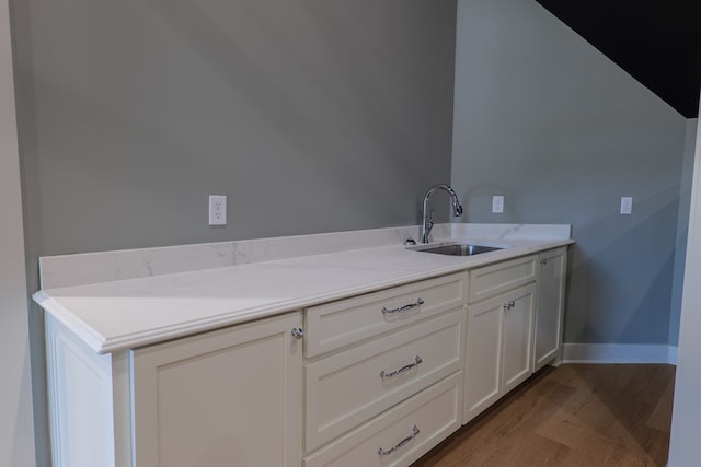 bathroom featuring sink and hardwood / wood-style floors