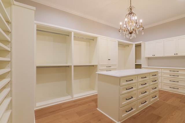 walk in closet featuring light hardwood / wood-style flooring