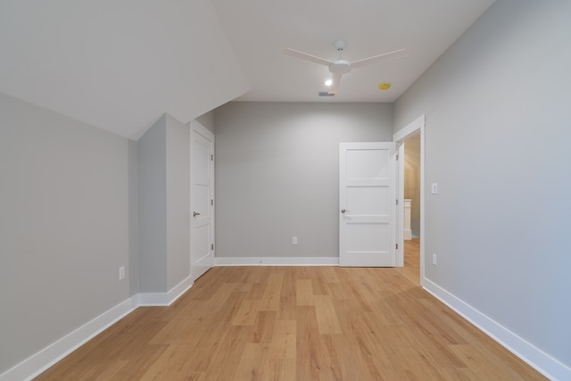 bonus room with ceiling fan and light hardwood / wood-style floors