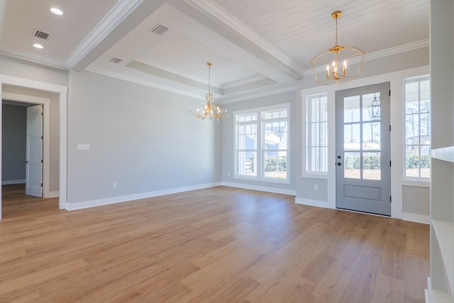 foyer with a notable chandelier, plenty of natural light, and light hardwood / wood-style floors