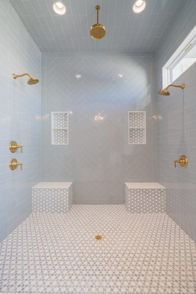 bathroom with a tile shower