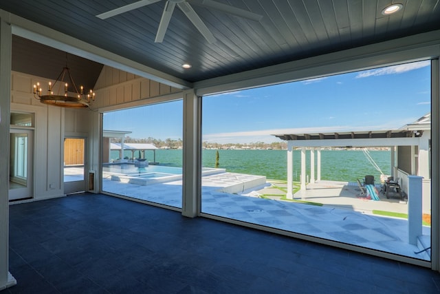 entryway featuring a water view, wooden ceiling, lofted ceiling, and a chandelier