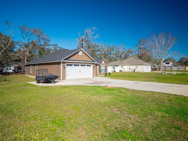 exterior space featuring concrete driveway, an attached garage, and a lawn