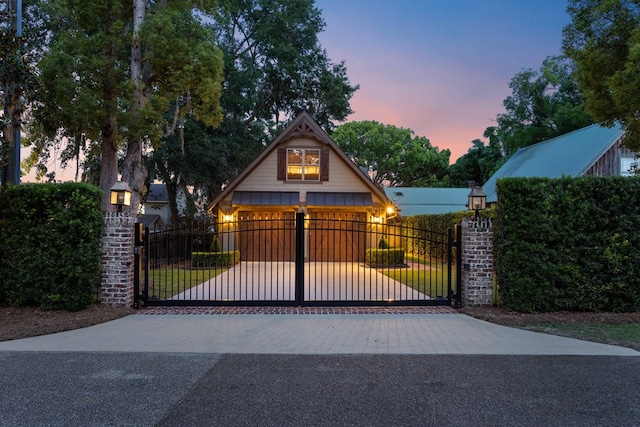 view of gate at dusk