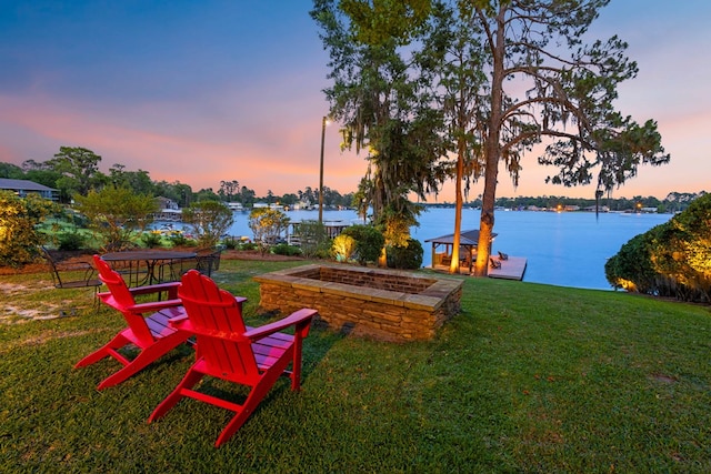 yard at dusk with a water view