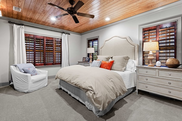 carpeted bedroom with ceiling fan and wooden ceiling