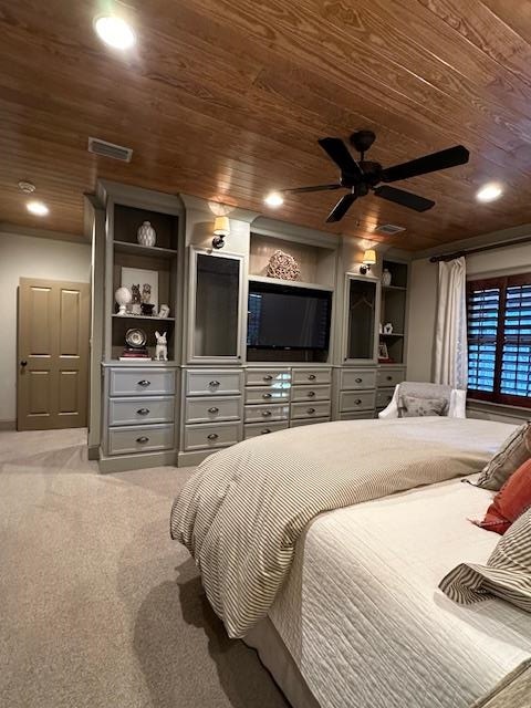 carpeted bedroom featuring wood ceiling and ceiling fan