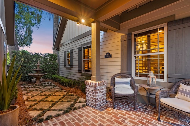 view of patio terrace at dusk