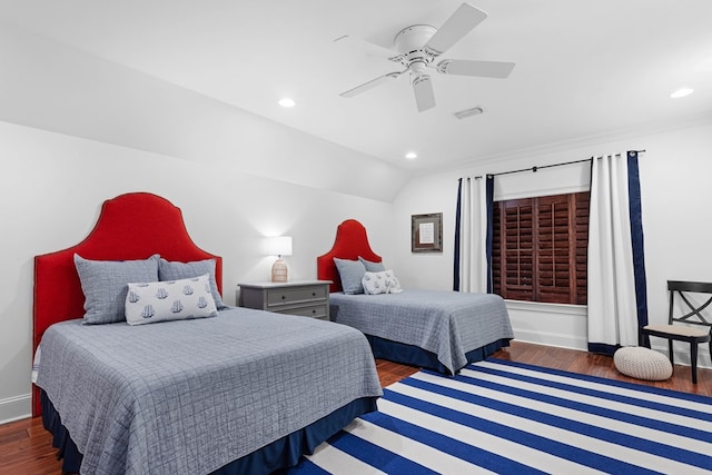 bedroom with vaulted ceiling, dark hardwood / wood-style floors, and ceiling fan