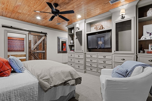 bedroom with carpet floors, ornamental molding, ceiling fan, wood ceiling, and a barn door