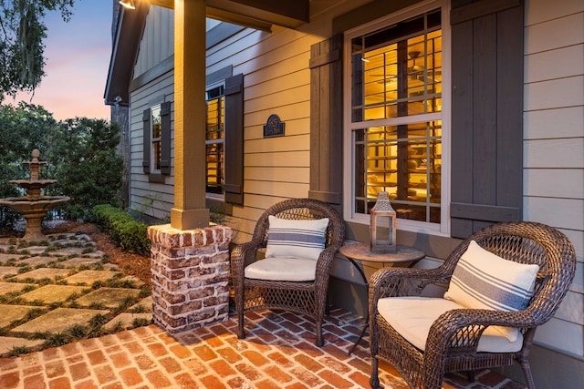 view of patio terrace at dusk