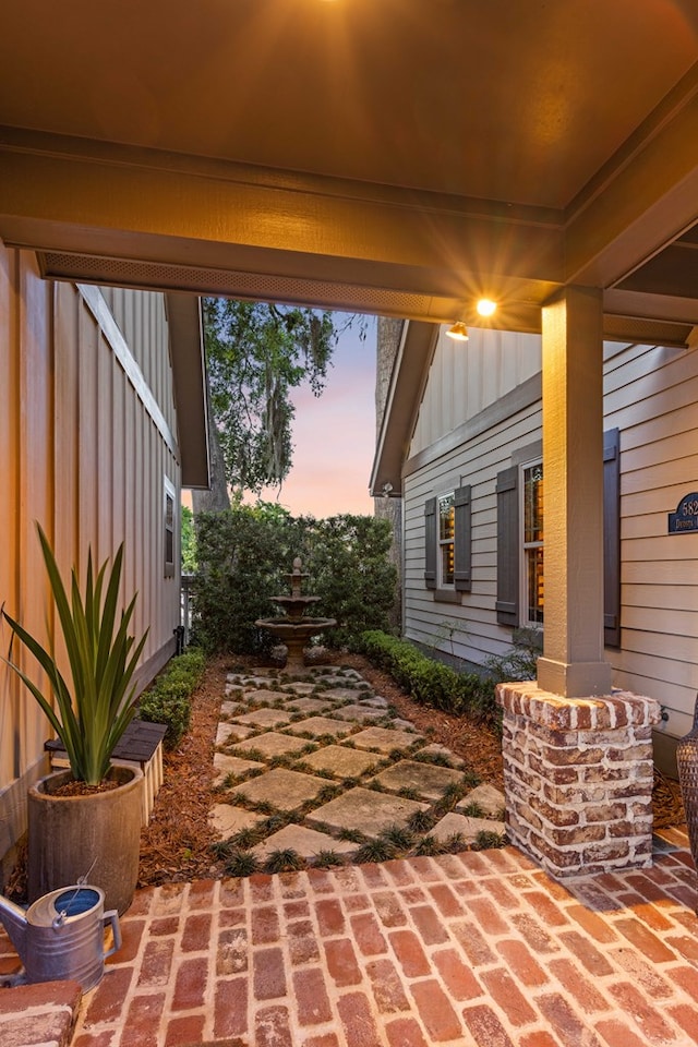 view of patio terrace at dusk