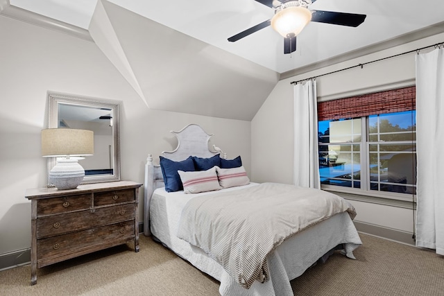 bedroom with lofted ceiling, light carpet, and ceiling fan