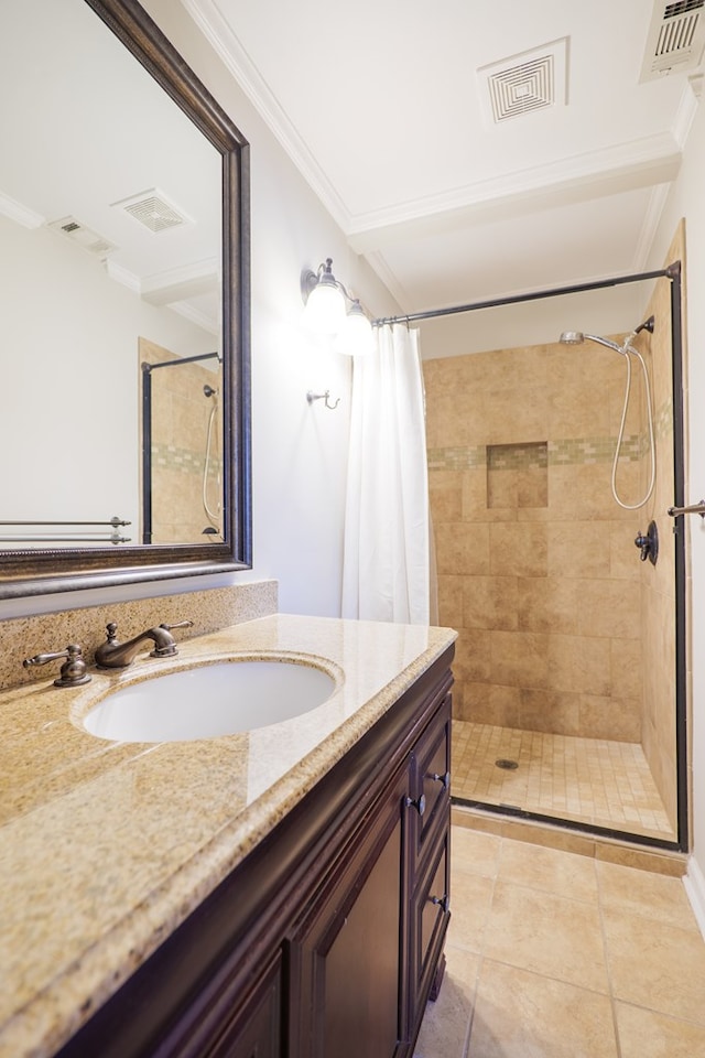 bathroom with walk in shower, tile patterned floors, vanity, and ornamental molding