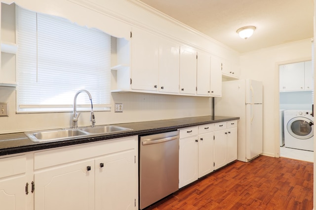 kitchen featuring washer / clothes dryer, dishwasher, sink, and white cabinets