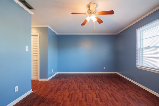 unfurnished room with dark wood-type flooring, ceiling fan, and crown molding