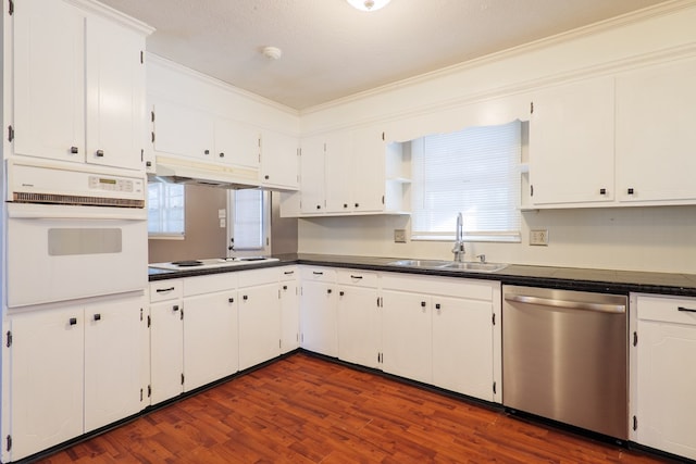 kitchen featuring sink, white appliances, white cabinetry, a textured ceiling, and dark hardwood / wood-style flooring