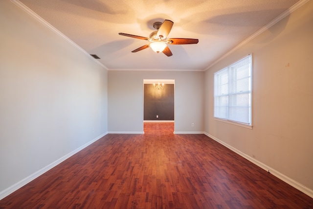 spare room featuring crown molding, dark wood-type flooring, a textured ceiling, and ceiling fan