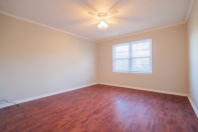 empty room featuring dark wood-type flooring, ceiling fan, and crown molding