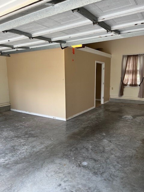 5054 Hammock Trl, Lake Park, GA 31636 - garage featuring baseboards