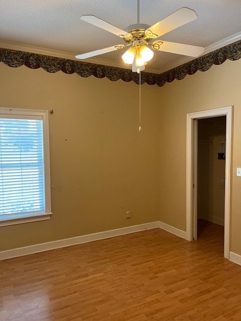 5054 Hammock Trl, Lake Park, GA 31636 - unfurnished room featuring light wood finished floors, a ceiling fan, ornamental molding, baseboards, and a textured ceiling