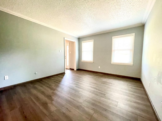 unfurnished room with dark hardwood / wood-style flooring, ornamental molding, and a textured ceiling