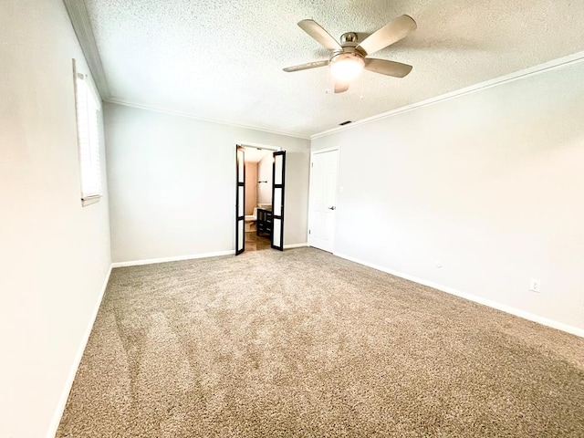 unfurnished room featuring ceiling fan, ornamental molding, carpet, and a textured ceiling