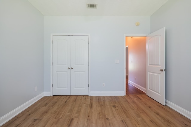 247 Harlee Ln, Ray City, GA 31645 - unfurnished bedroom featuring light wood-style floors and a closet