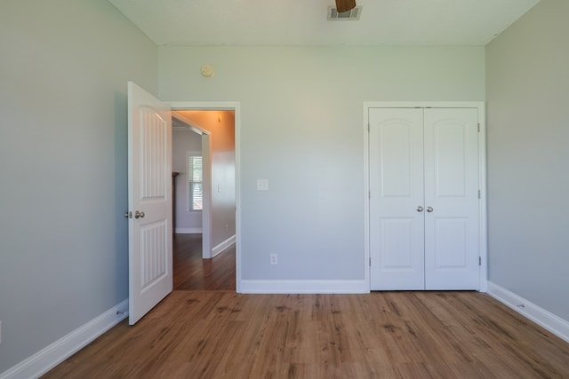 247 Harlee Ln, Ray City, GA 31645 - unfurnished bedroom featuring wood finished floors and a closet