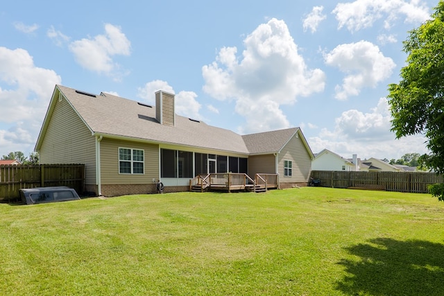 247 Harlee Ln, Ray City, GA 31645 - rear view of property with a sunroom, a fenced backyard, a chimney, and a deck