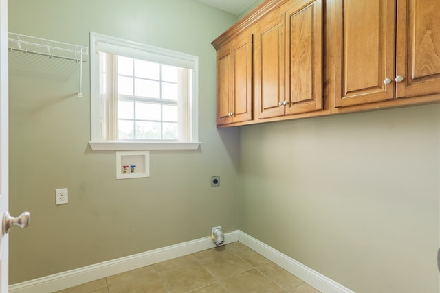 247 Harlee Ln, Ray City, GA 31645 - washroom featuring hookup for an electric dryer, cabinet space, hookup for a washing machine, and light tile patterned floors