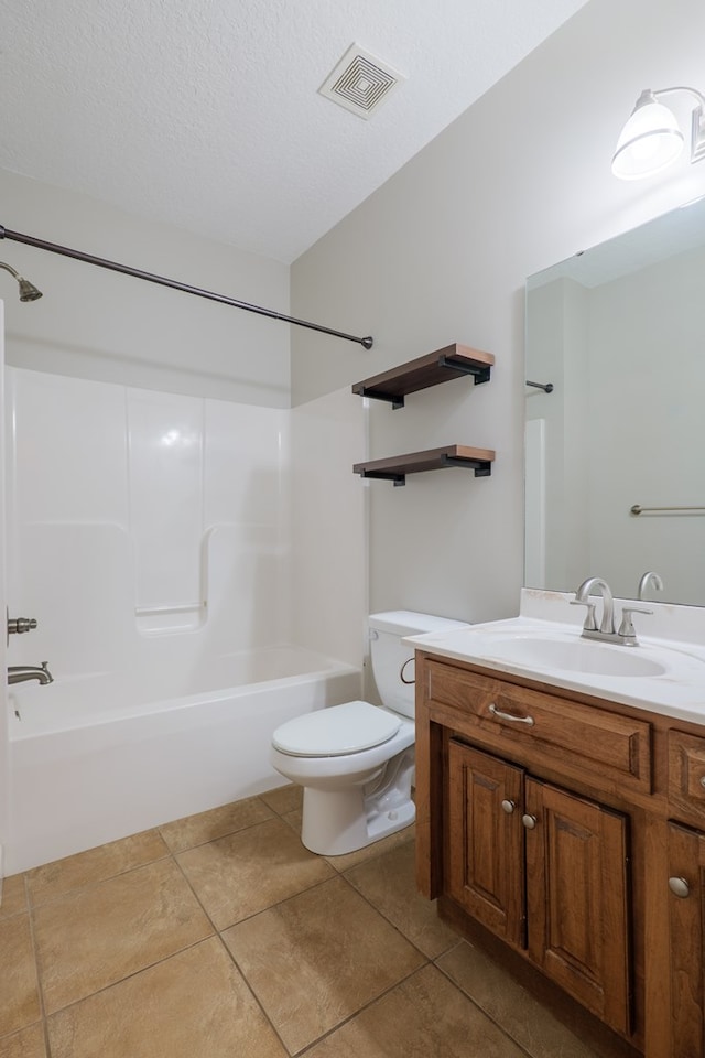 247 Harlee Ln, Ray City, GA 31645 - full bathroom featuring vanity, shower / bathtub combination, tile patterned flooring, and a textured ceiling