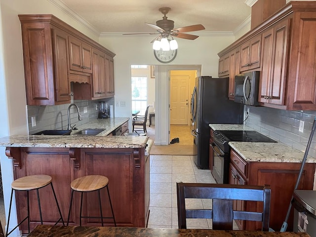 kitchen featuring light tile patterned flooring, crown molding, black electric range, light stone countertops, and backsplash