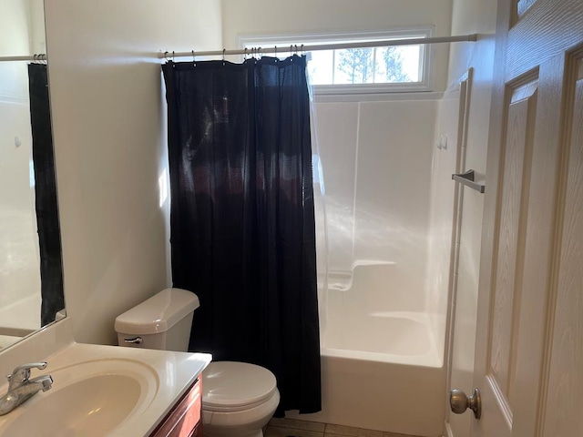 full bathroom featuring vanity, shower / bath combo, and toilet