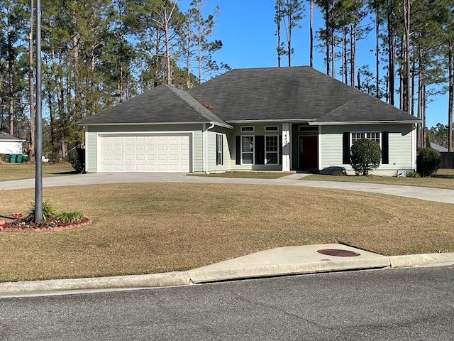 ranch-style home featuring a garage and a front lawn