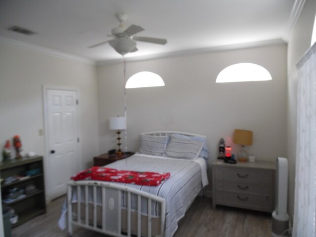 2502B Jerry Jones Dr Unit 3, Valdosta, GA 31602 - bedroom featuring crown molding, ceiling fan, wood finished floors, and multiple windows