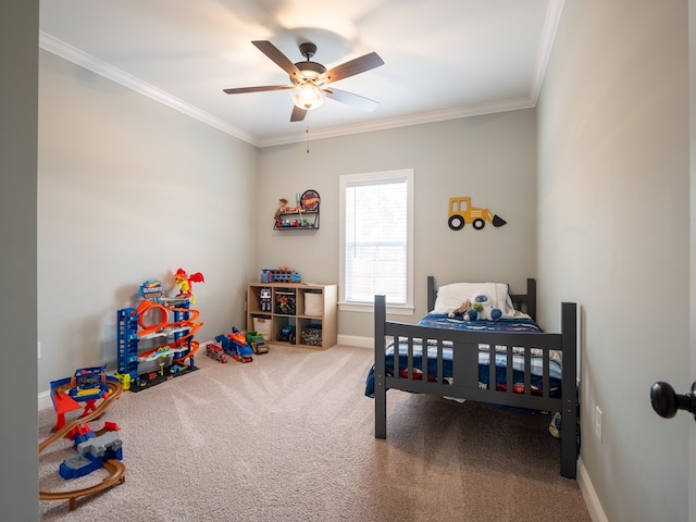 carpeted bedroom featuring ornamental molding and ceiling fan